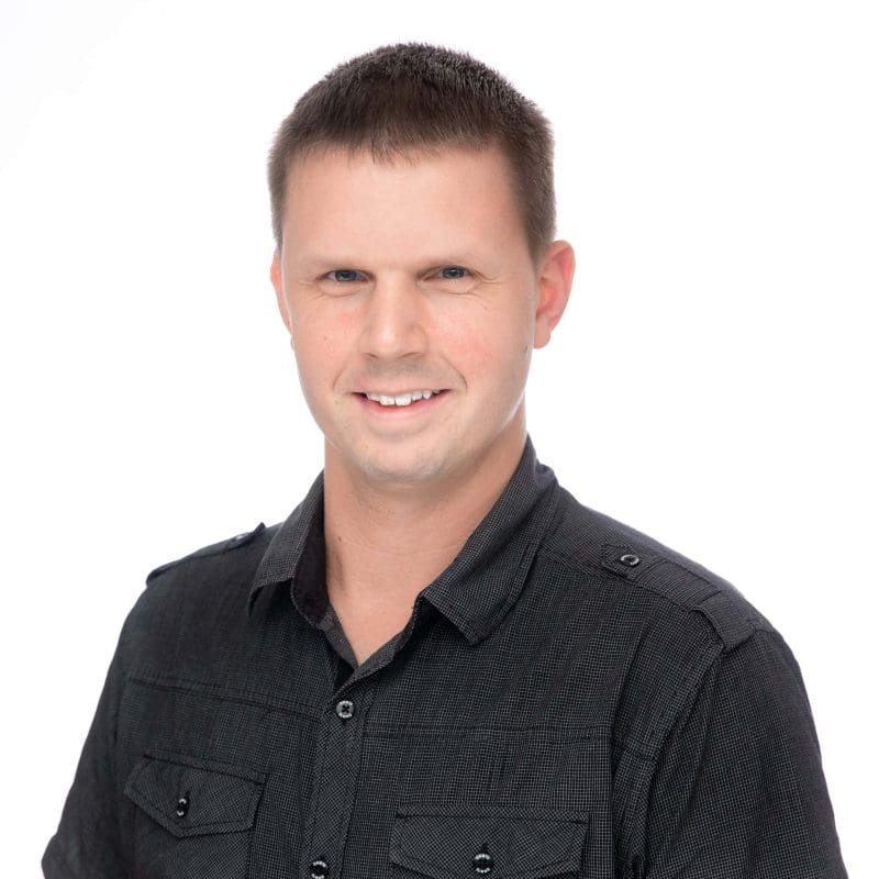 Travel advisor Richard Muff smiling in a professional black shirt, representing personalized travel services and adventure tourism.